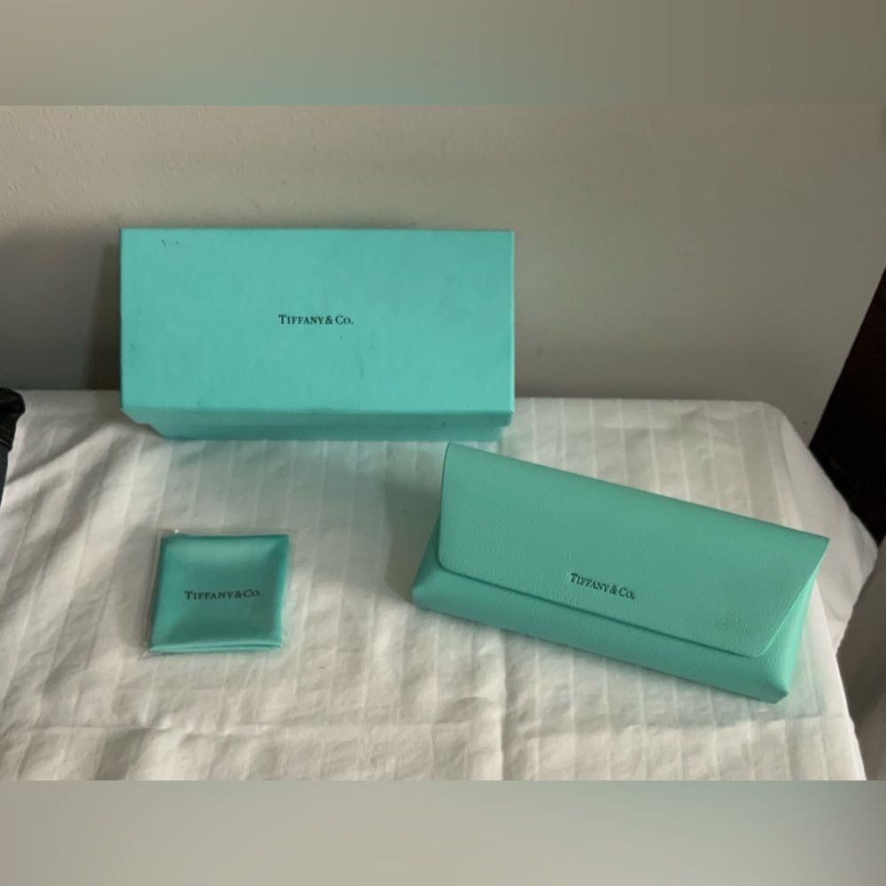 Authentic Tiffany & Co. sunglass case set in the signature Tiffany blue.